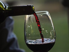 A man pours a glass of wine at a vineyard in Chile on Jan. 25, 2014. A Federal Court says labelling West Bank wines as products of Israel is misleading and deceptive. The court ruling today orders the Canada Food Inspection Agency to decide how the wines should be labelled in the politically charged case.