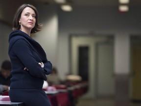 Nathalie Provost poses for a photograph following a news conference at Ecole Polytechnique in Montreal on November 28, 2014. Mass-shooting survivor Nathalie Provost has quit the federal firearms advisory committee in frustration, saying she is extremely disappointed with the Liberal government's failure to crack down on assault-style rifles.