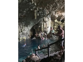 People tour a cave in Matanzas, Cuba in this undated photo. A Newfoundland woman is warning travellers to do their research before adventurous excursions abroad after she was hospitalized from a mysterious disease traced back to a cave she visited in Cuba. The illness was eventually identified as a respiratory infection called histoplasmosis, or "cave disease," caused by spores from bird or bat droppings in damp soil. THE CANADIAN PRESS/HO, Terry Murphy MANDATORY CREDIT