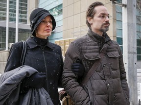 Jennifer and Jeromie Clark leave a sentencing hearing after to couple were found guilty of criminal negligence causing the death of their 14-month-old son in 2013, outside the courts centre in Calgary, Friday, Feb. 8, 2019.