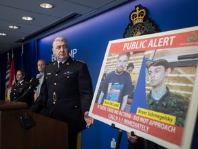 Security camera images recorded in Saskatchewan of Kam McLeod, 19, and Bryer Schmegelsky, 18, are displayed as RCMP Assistant Commissioner Kevin Hackett steps away from the podium after speaking during a news conference in Surrey, B.C., on Tuesday July 23, 2019. A nationwide manhunt was on Tuesday for two teenagers labelled by police as suspects in the deaths of three people in northern British Columbia.