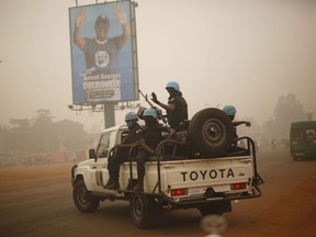 MINUSCA UN forces from Rwanda patrol the streets of Bangui, Central African Republic, Friday Feb. 12, 2016. Canada is being urged to make an extremely modest contribution towards helping plug a US$1 million funding shortfall that would allow the Special Criminal Court for war-ravaged Central African Republic to keep operating.