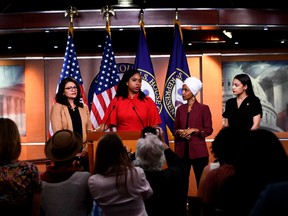 In this file photo taken on July 15, 2019 US Representatives Ayanna Pressley (D-MA) speaks as, Ilhan Omar (D-MN)(2R), Rashida Tlaib (D-MI) (R), and Alexandria Ocasio-Cortez (D-NY) look on during a press conference, to address remarks made by US President Donald Trump earlier in the day, at the US Capitol in Washington, DC