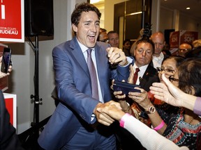 Prime Minister Justin Trudeau greets supporters during a Team Trudeau 2019 campaign event in Edmonton on Thursday, July 11, 2019.