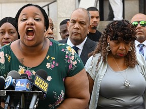 Daughter Emerald Snipes, (L) Eric Garner's mother Gwen Carr (R) along with National Action Network founder and President Rev. Al Sharpton(behind)speak to the press outside the Eastern District of New York on July 16, 2019.