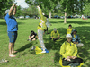 Falun Gong practitioners exercising in an Ottawa park June 22, when one of the group says he entered the nearby dragon-boat festival and was told by the festival CEO to remove his Falun Gong T-shirt, citing sponsorship of the event by the Chinese embassy.