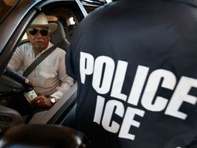 A special agent from Immigration and Customs Enforcement (ICE) searches a vehicle heading into Mexico at the Hidalgo border crossing on May 28, 2010 in Hidalgo, Texas.