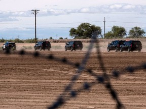 U.S. President Donald Trump's caravan leaves the US-Mexico border after a visit to Calexico, California, as seen from Mexicali, Baja California state, Mexico, on April 5, 2019.