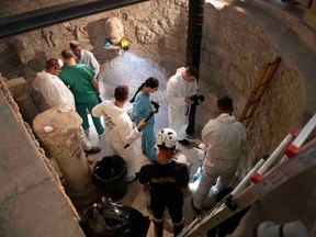 This handout photo made available by the Vatican Media on July 20, 2019 shows the opening of the ossuary at the Teutonic Cemetery in the Vatican as part of a probe into the case of Emanuela Orlandi, an teenager who disappeared in 1983 in one of Italy's darkest mysteries.