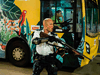 A police officer holds a firearm during clashes with protesters who had gathered outside Kwai Chung police station, in support of protesters detained with the charge of rioting, in Hong Kong on July 30, 2019.