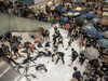 Riot police attempt to disperse demonstrators in an them inside a shopping mall during a protest in the Shatin district of Hong Kong, on July 14, 2019.