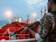An image grab taken from a broadcast by Islamic Republic of Iran Broadcasting (IRIB) on July 22, 2019 shows a member of the Iranian Revolutionary Guards onboard the tanker Stena Impero as it is anchored off the Iranian port city of Bandar Abbas.