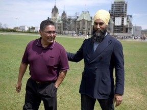 NDP leader Jagmeet Singh walks with Chief Rudy Turtle of the Grassy Narrows First Nation after announcing his candidacy for the NDP in Kenora, Ont. for the fall election, on the lawn of Parliament Hill in Ottawa on Monday, July 29, 2019.