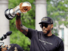 Kawhi Leonard hold his MVP trophy during the Toronto Raptors victory parade on June 17, 2019.