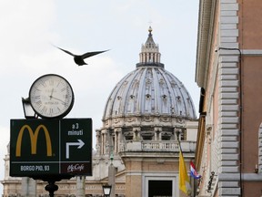 A McDonald's sign is seen on Via della Conciliazione street in Rome in front of Vatican City's St. Peter's Square, January 3, 2017.