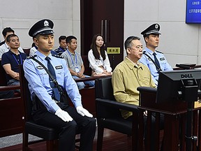 This handout photo taken on June 20, 2019 and released by the Tianjin No.1 Intermediate Court shows former Interpol chief Meng Hongwei (2nd R) during his trial at the court in Tianjin, northern China.