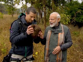 Narendra Modi watchs bear Grylls sniff animal dung as they traverse Jim Corbett National Park in an upcoming episode of 'Man vs Wild'.