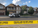 York Regional police officers stand outside of a home in Markham, Ont. on Sunday, July 28, 2019. Police say one person is in custody after four bodies were found in a home north of Toronto on Sunday afternoon.