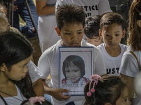 Relatives and friends attend the funeral of three-year-old Kateleen Myca Ulpina on July 9, 2019 in Rodriguez, Rizal province, Philippines.