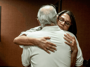 Tanya Gersh, a Montana real estate agent, embraces her father Lloyd Rosenstein following a hearing at the Russell Smith Federal Courthouse on July 11, 2019, in Missoula.