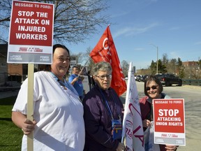 These protestors outside Bruce-Grey-Owen Sound MPP Bill Walker's Owen Sound office Monday were upset about health care changes and funding. From left, Pam Lobsinger, president of the Ontario Nurses Association bargaining unit at Grey Bruce Health Services, Linda Dow-Sitch, vice-co-ordinator Local 4, ONA, and Julia Lobsinger, a retired registered nurse and former ONA leader locally and a regional representative on ONA's provincial board.