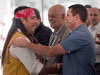 Mohawk Grand Chief Serge Simon, left, shakes hands with Oka Mayor Pascal Quevillon after ceremonies marking the 25th anniversary of the Oka crisis, July 11, 2015 in Kanesatake, Que.