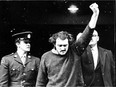 FLQ terrorist Paul Rose, one of the most notorious figures of the 1970 October Crisis, gives a defiant salute as he arrives for a court appearance on Jan. 7, 1971.