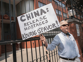 Lorne Hicks' holds a one-person protest against the Chinese imprisonment of two Canadians, in front of the Chinese Consulate in Toronto on July 10, 2019.