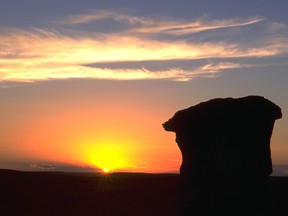 A Hoodoo is silhouetted at sunset in Writing-on-Stone Provincial Park.