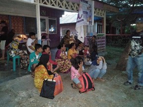 Villagers stay out of their homes following 7.3 magnitude earthquake in Labuha, North Maluku on July 14, 2019. - A major 7.3-magnitude earthquake hit the remote Maluku islands in eastern Indonesia on July 14, sending panicked residents running into the streets, but no tsunami warning was issued.