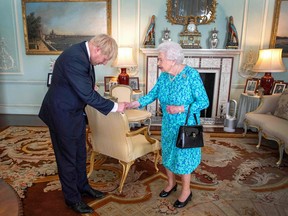 Boris Johnson takes office as Britain's new Prime Minister and First Lord of the Treasury at the Queen's request  on Wednesday at Buckingham Palace.