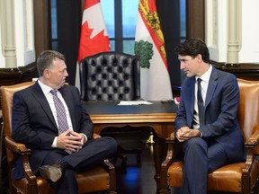 Prime Minister Justin Trudeau meets with Premier of Prince Edward Island Dennis King on Parliament Hill in Ottawa on Monday, July 8, 2019.