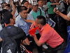 People scuffle outside the hotel where Taiwan’s President Tsai Ing-wen stayed in New York City, July 11, 2019.