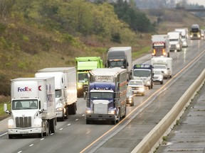 Transport trucks head east on Highway 401 near London, Ont., in a file photo from Nov. 2, 2017.