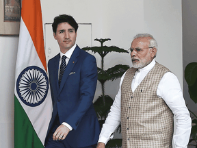 Justin Trudeau and Indian Prime Minister Narendra Modi arrive for a meeting at Hyderabad House in New Delhi on Feb. 23, 2018.