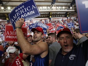 Supporters hold up signs prior to a "Make America Great Again Rally" at the Pennsylvania Farm Show Complex & Expo Center April 29, 2017 in Harrisburg, Pennsylvania.