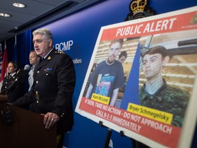 Security camera images recorded in Saskatchewan of Kam McLeod, 19, and Bryer Schmegelsky, 18, are displayed as RCMP Assistant Commissioner Kevin Hackett speaks during a news conference in Surrey, B.C., on Tuesday July 23, 2019. RCMP say two British Columbia teenagers who were first thought to be missing are now considered suspects in the deaths of three people in northern B.C.