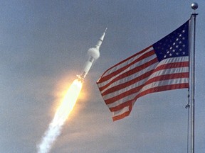 In this July 16, 1969, photo obtained from NASA the Saturn V rocket with the Apollo 11 crew  lifts off from the Kennedy Space Centre in Florida.