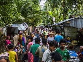 Buddhists and Muslims in a market in the village of Sin Tet Maw in Myanmar's Rakhine State, Sept. 10, 2018. With ethnic conflict spreading in Rakhine State in Myanmar, a government-led online shutdown could hide human rights abuses and leave vulnerable populations in the dark.