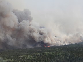 A forest fire burns near Timmins, Ont. on Thursday, May 24, 2012. THE CANADIAN PRESS/Ontario Ministry of Natural Resources-Christine Rosche