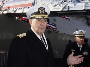 FILE - In this Dec. 1, 2018 file photo, Vice Chief of Naval Operations, Adm. William Moran describes the function of the USS Thomas Hudner prior to its commissioning ceremony  in Boston.  Moran, the Navy admiral set to become his service's top officer on Aug. 1, 2019, says he will instead retire.