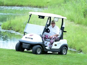 John Daly pulls up to the 17th green during the first round on the American Family Insurance Championship at University Ridge Golf Course on June 21, 2019 in Madison, Wisconsin.