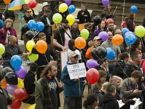 Protestors rally outside the Alberta Legislature in support of banning conversion therapy, in Edmonton Thursday June 6, 2019.
