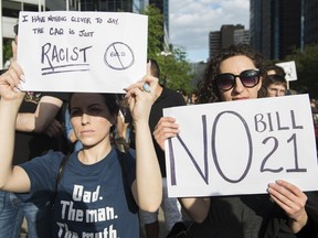 People attend a demonstration to protest against the Quebec government's Bill 21 in Montreal, Monday, June 17, 2019.