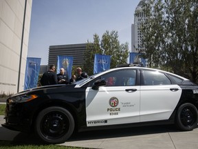 The new Ford Motor Co. Police Responder hybrid vehicle is displayed during an event outside of Los Angeles Police Department (LAPD) headquarters in Los Angeles, California, U.S., on Monday, April 10, 2017. Ford says its new Police Responder hybrid sedan, a modified Fusion, is the first gasoline-electric cop car to be "pursuit-rated," meaning it can race through city streets while navigating crowded intersections or hopping curbs.