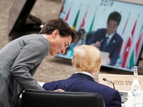 U.S. President Donald Trump and Canada's Prime Minister Justin Trudeau attend a G20 session during the leaders summit in Osaka, Japan, June 29, 2019.