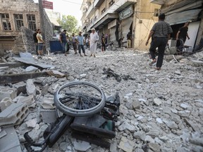 A wheelchair is seen amid the rubble of destroyed buildings following a reported regime air strike on the town of Ariha, in the south of Syria's Idlib province, on July 24, 2019.