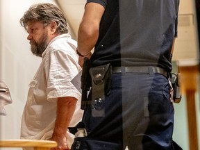 Carl Stephen Beech leaves the hearing in Gothenburg District Court for his extradition back to the UK after he got remanded for arrest. Mr. Beech, a former nurse, was charged and later convicted of perverting the course of justice after he fabricated accusations of a paedophile ring that included high-profile political and military figures.