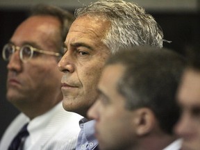 U.S. financier Jeffrey Epstein (C) appears in court where he pleaded guilty to two prostitution charges in West Palm Beach, Florida, U.S. July 30, 2008.