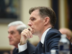 Former Special Prosecutor Robert Mueller (L), with former Deputy Special Counsel Aaron Zebley, listens during a hearing before Congress on July 24, 2019, in Washington, D.C.